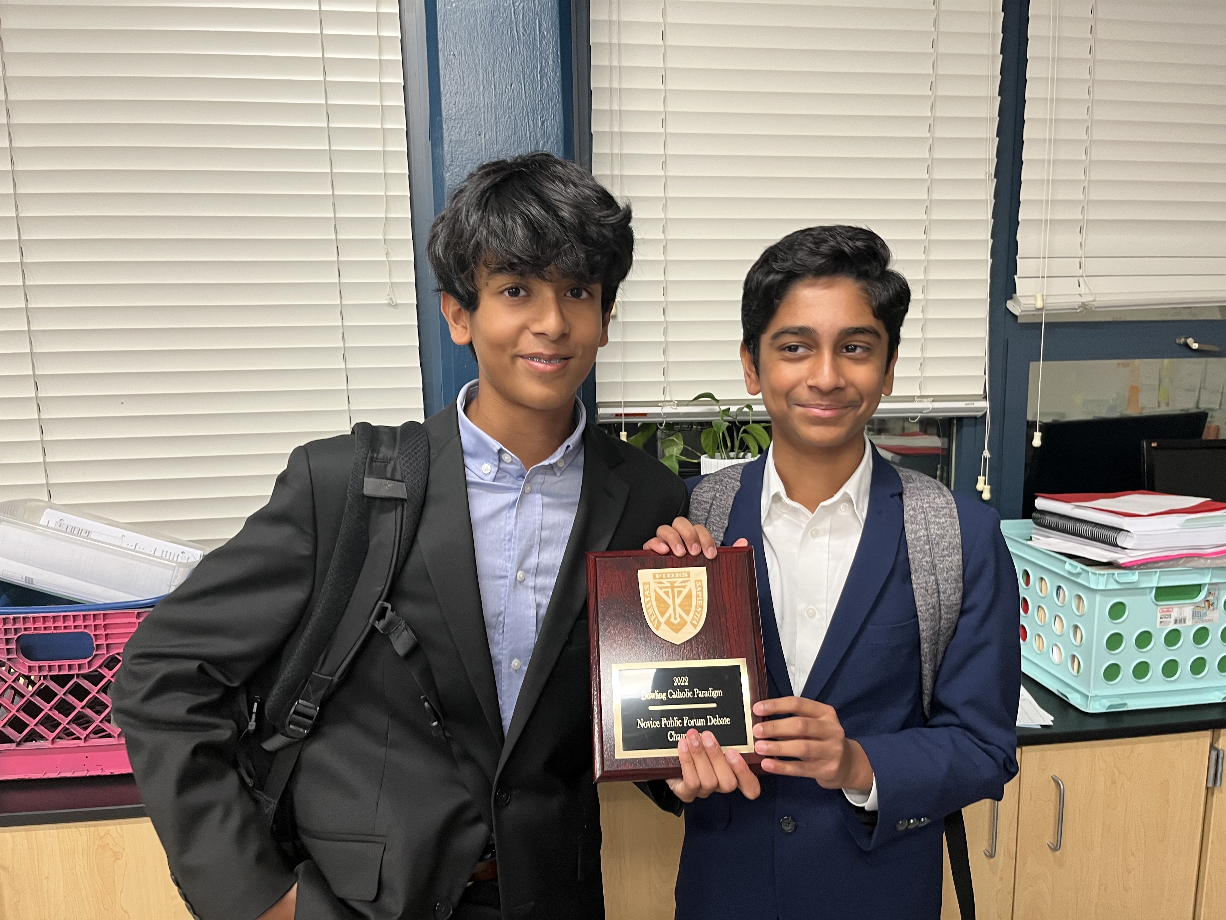 Debate champions with award